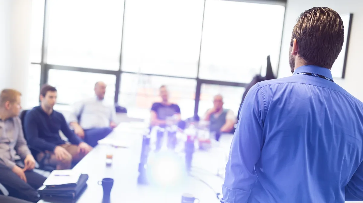 A presenter leading a group training session