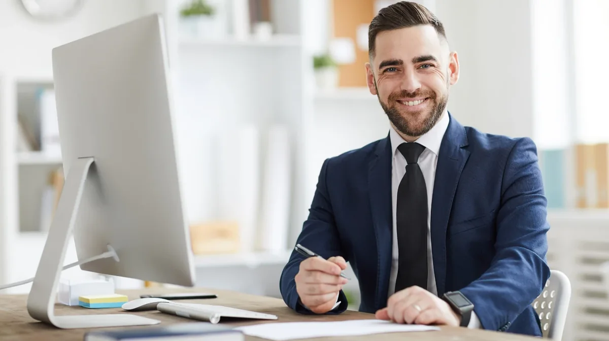 A professional working at an office desk
