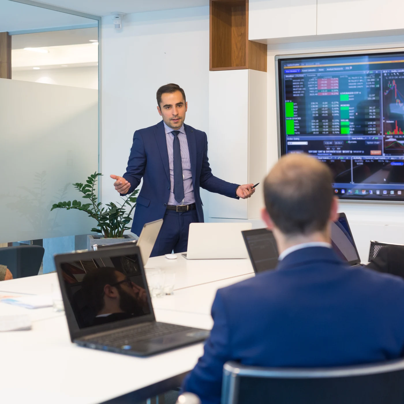 Professional presenting information to colleagues.