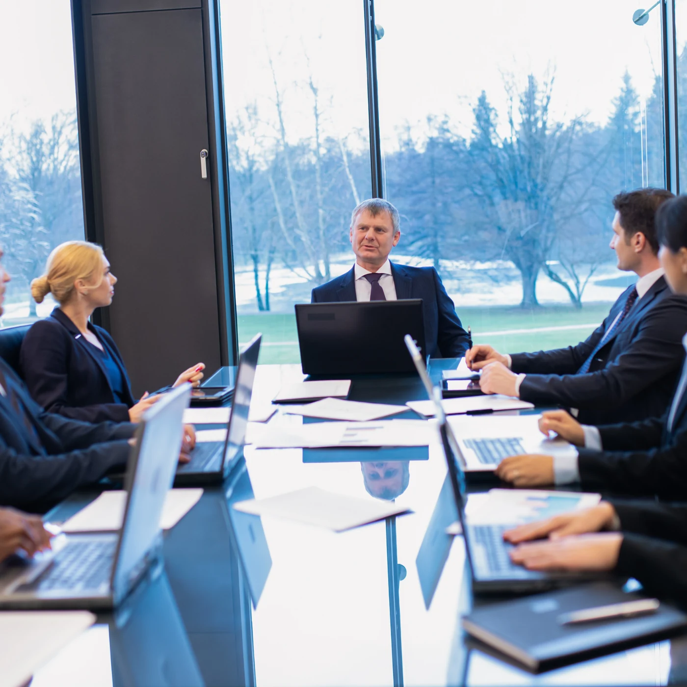 Colleagues meeting around a conference table.