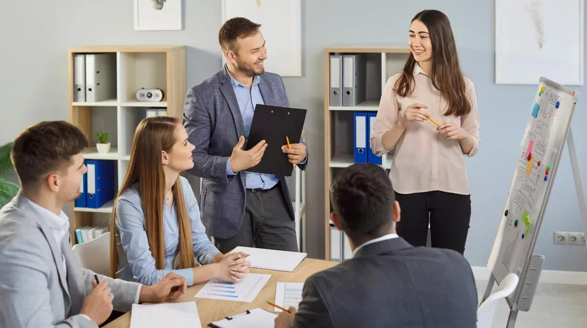 A professional leading a presentation in an office