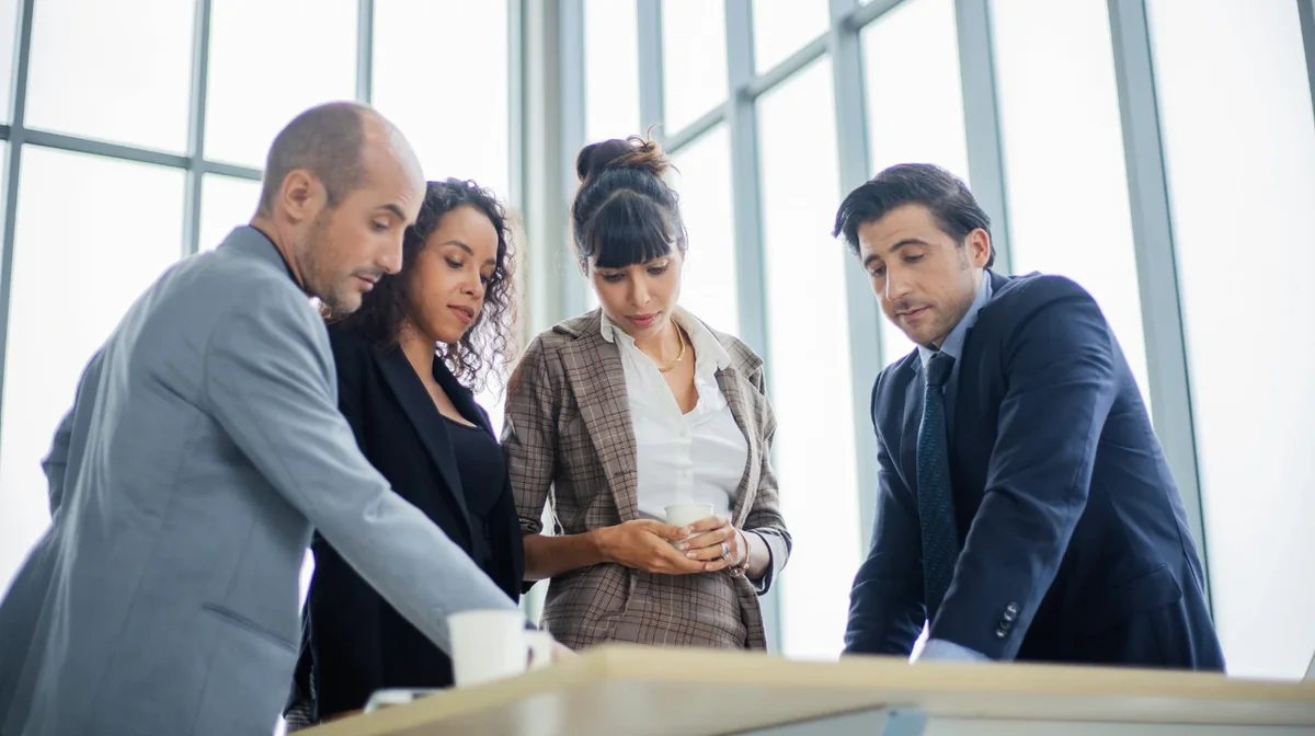 A project team reviewing a shared document in a meeting