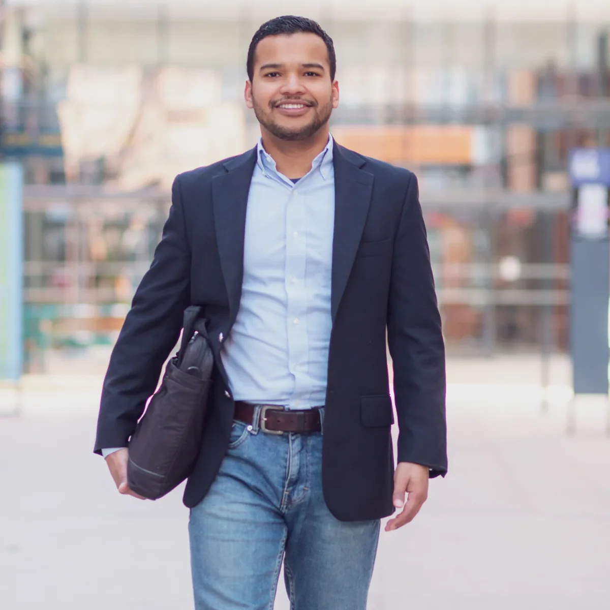 A professional walking outside an office building