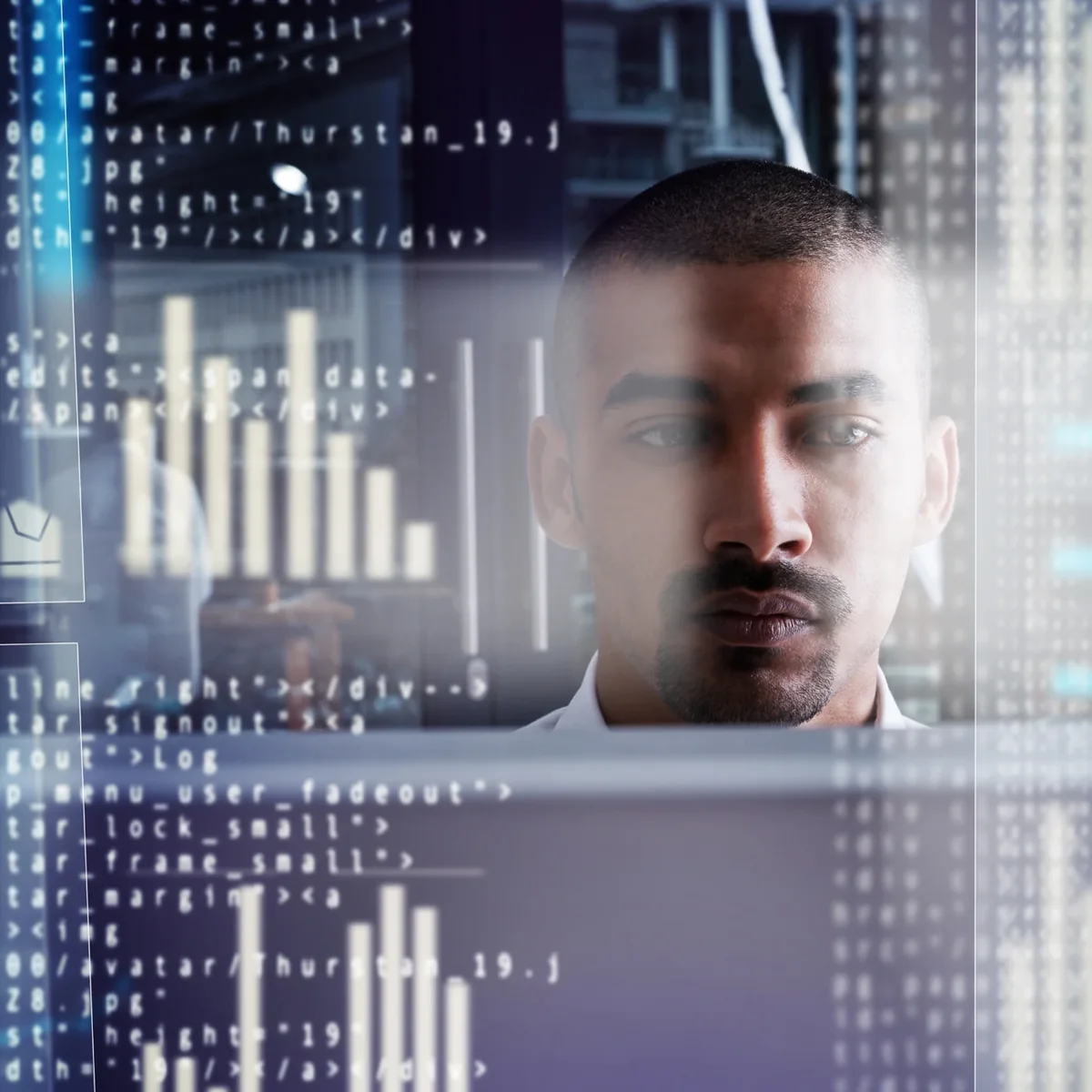 A technology professional seen through a display of information