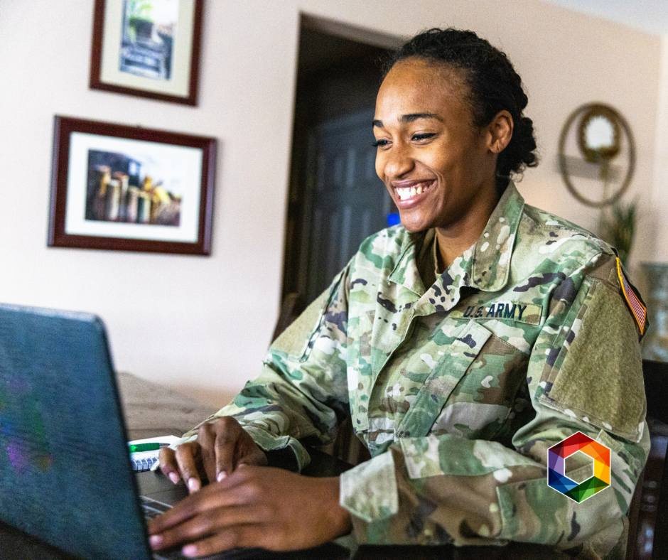 U.S. Army service member working on a laptop