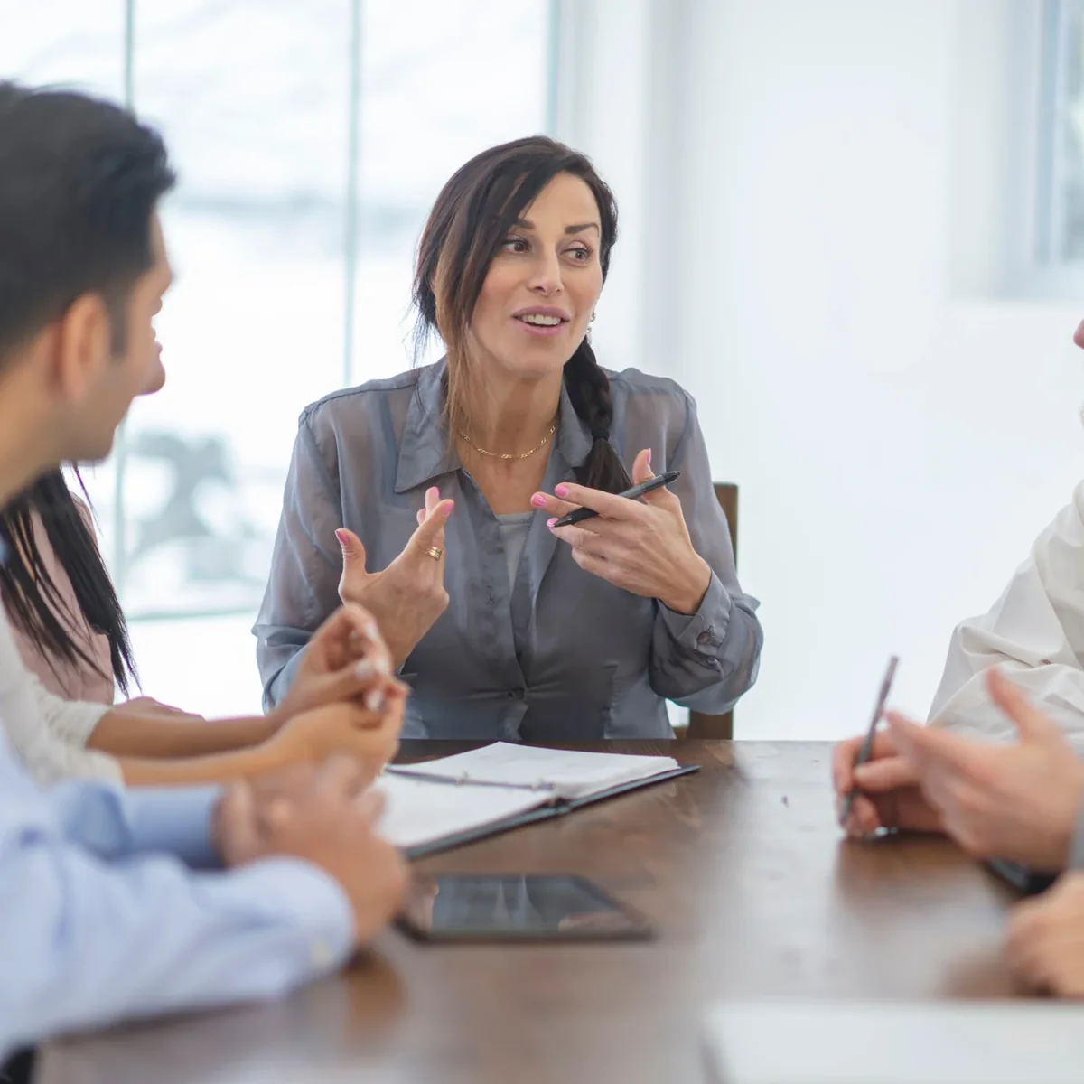 A woman leading a workplace discussion